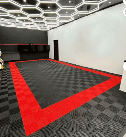 Professionally installed black and red modular garage tile floor